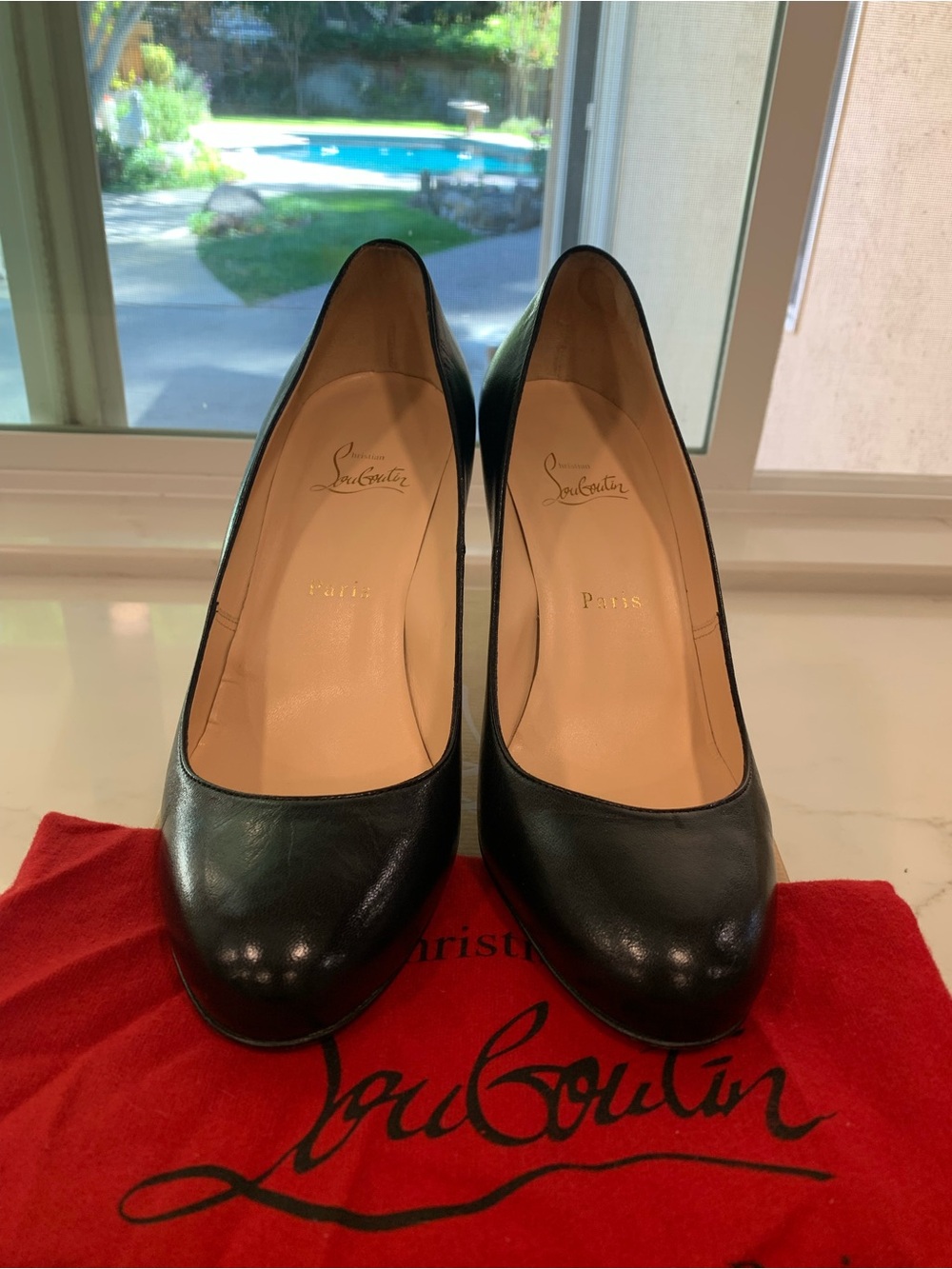 Christian Louboutin Black Leather Round-Toe Pumps